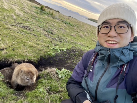 Xiang Yang with a wombat in Tasmania